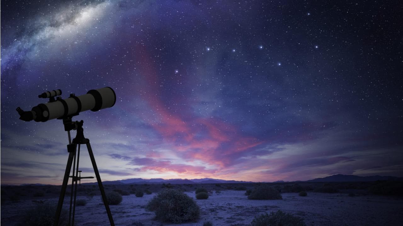 Night sky with stars and telescope for stargazing